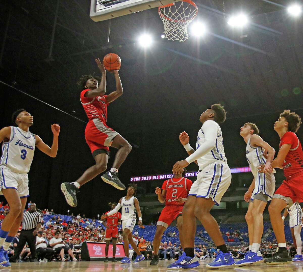 Hitchock Kelshaun Johnson (1) drives for two in first half. Hitchcock defeated Hooks 69-36 in Class 3A semifinals on Thursday, March 9,2023 at the Alamodome.