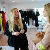 Vanessa Lewis, left, owner of Penfield Collective, a new store selling laid back, luxury apparel, chats with customer and fellow business owner Shana Swanson at the store in Westport, Conn. on Thursday, March 09, 2023.