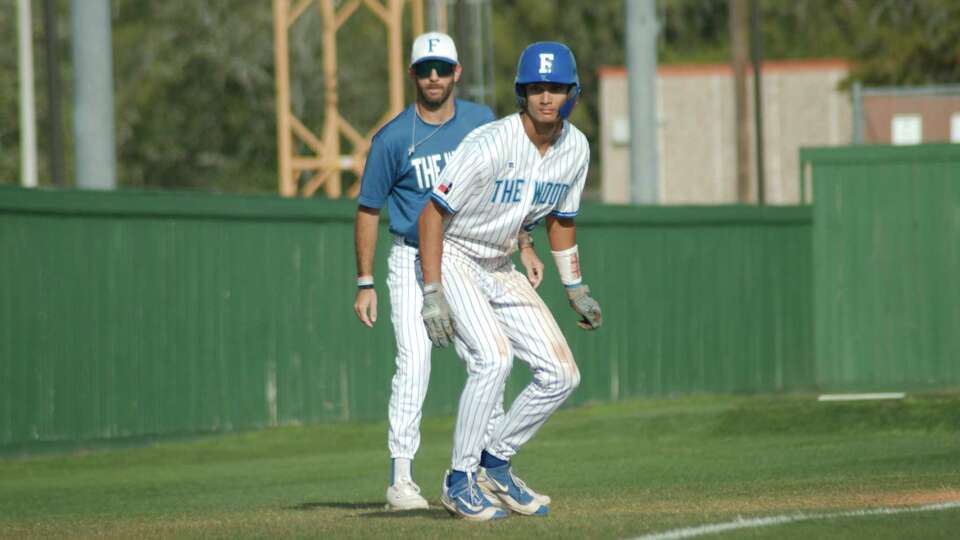 Friendswood baseball coach Cory Benavides waits to send FriendswoodÕs Blake Encarnacion (8) home against Alvin Thursday, Mar 9, 2023 at Alvin High School.