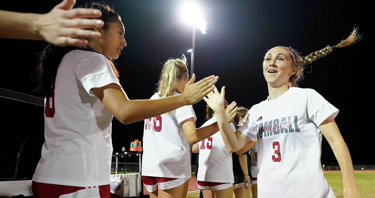 Tomball forward Kaidence Dietrich (3) high-fives teammates during player introductions before a high school soccer game against Klein Cain, Wednesday, March 8, 2023, in Houston.