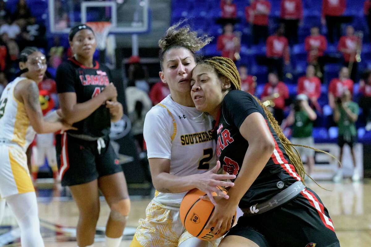 Southeastern Louisiana guard Cierria Cunningham (2) bumps into Lamar guard R'Mani Taylor (30) during the first half an NCAA college basketball game in the finals of the Southland Conference women's tournament in Lake Charles, La., Thursday, March 9, 2023. (AP Photo/Matthew Hinton)