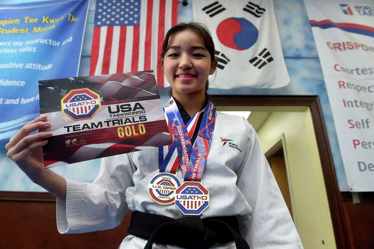 Haley Han, 15, is photographed with her most recent awards at World Champion Taekwondo in New Haven on March 9, 2023.