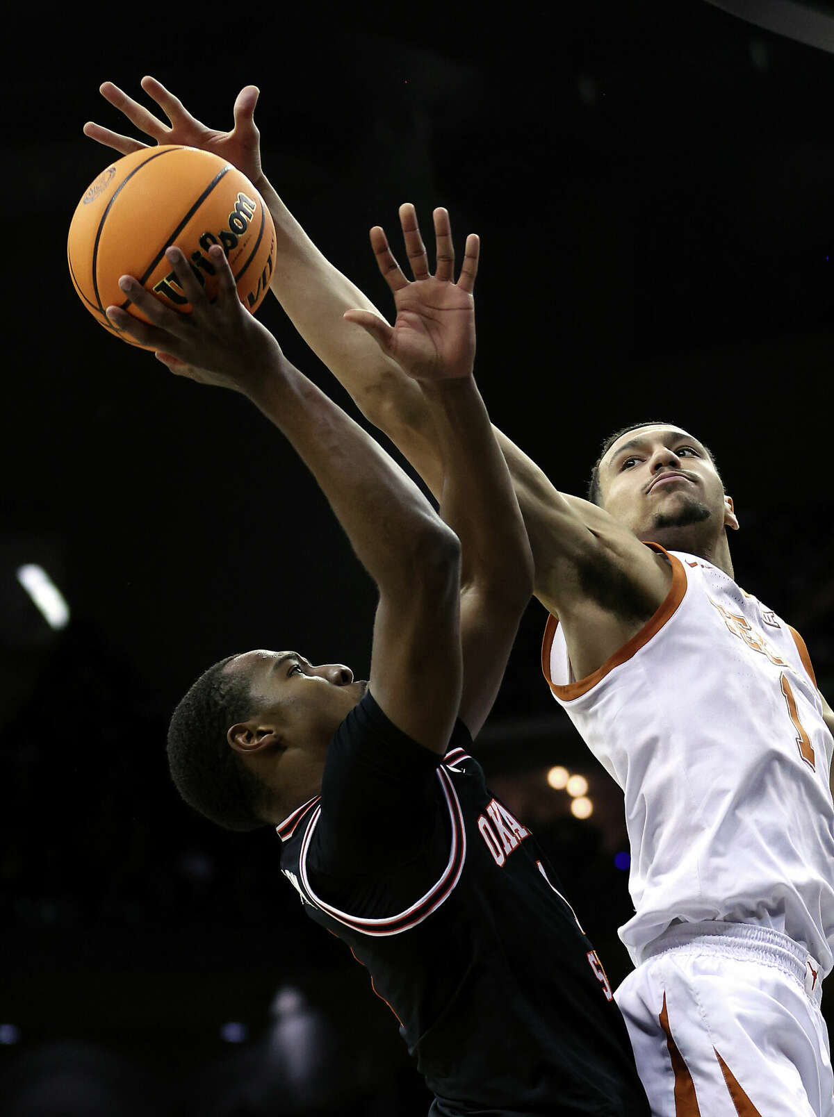 KANSAS CITY, MISSOURI - MARCH 09: Dylan Disu #1 of the Texas Longhorns blocks a shot by Bryce Thompson #1 of the Oklahoma State Cowboys during the Big 12 Tournament game at T-Mobile Center on March 09, 2023 in Kansas City, Missouri. (Photo by Jamie Squire/Getty Images)
