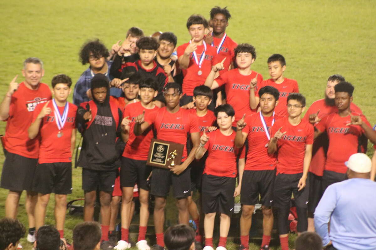   The San Jacinto Intermediate boys track and field team celebrate their newly-captured track and field title at Allan Brown Stadium Wednesday night.