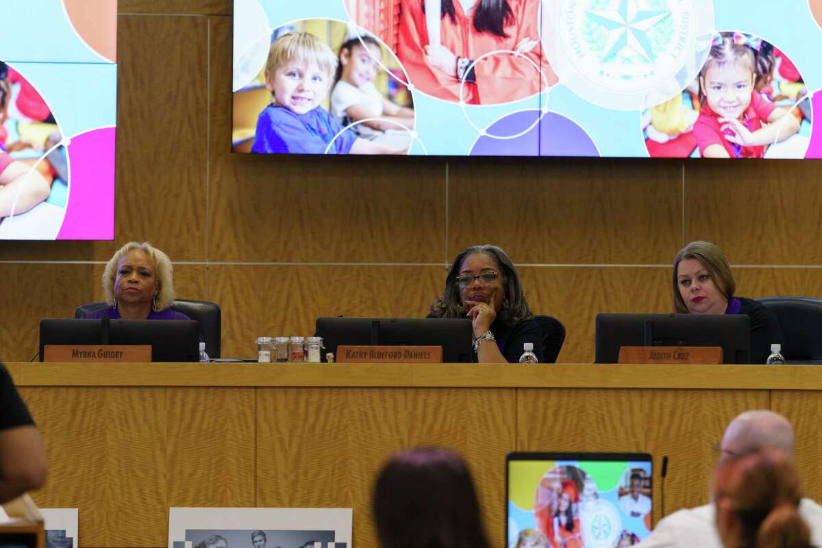Board members of HISD Myrna Guidry, Kathy Blueford-Daniels, and Judith Cruz listens to a speaker at HISD board meeting in Houston, Texas on Thursday, March 9, 2023.