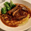 Polenta, regularly available as an appetizer with mushrooms, is sometimes available as an entree with braised beef.