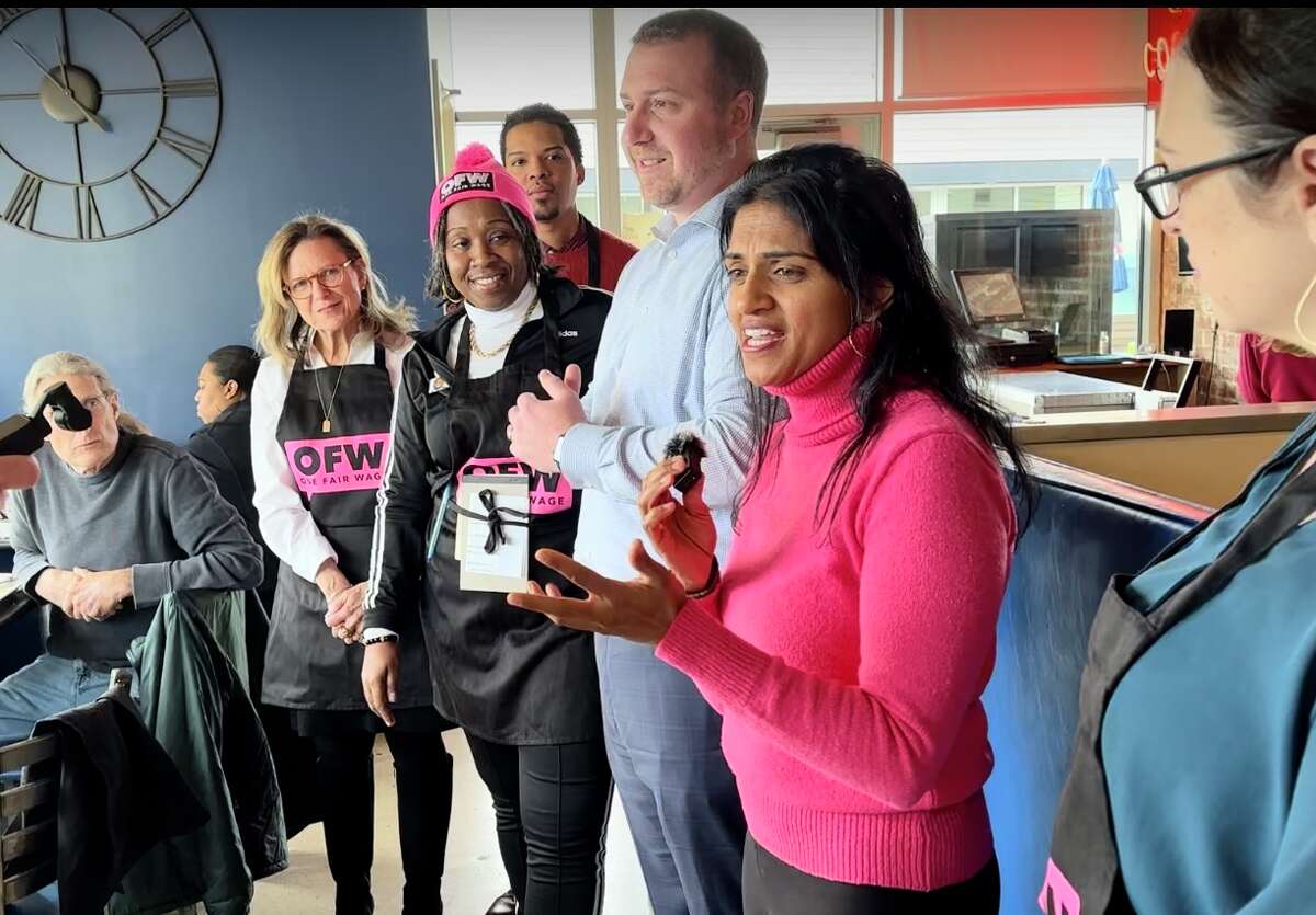 Saru Jayaraman, an activist and author from California, speaks at the Blue Plate Kitchen in West Hartford about the One Fair Wage campaign, an effort to eliminate the sub-minimum wage paid to restaurant servers and bartenders in Connecticut and 42 other states. Five CT legislators had just waited tables to call attention to the campaign and a bill in the state legislature. From left are Sen. Julie Kushner, D-Danbury; Rep. Robyn Porter, D-New Haven; Rep. Corey Paris, D-Stamford (rear); Ed Hawthorne, president of the state AFL-CIO; and at right, Rep. Kara Rochelle, D-Ansonia. 