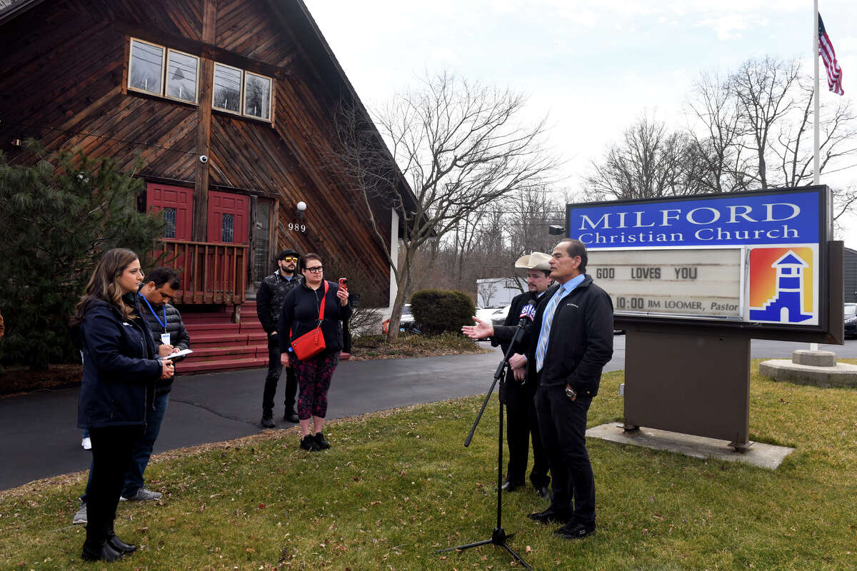 Pastor Jim Loomer, right, speaks during news conference in front of Milford Christian Church, in Milford, Conn. March 10, 2023. Loomer is seen here with attorney Brian Festa of We The Patriots USA.