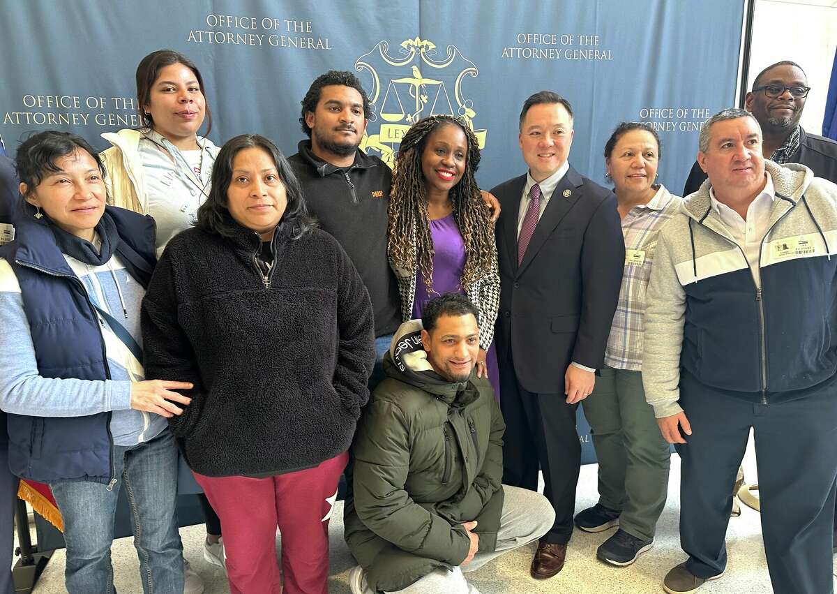 Members of the Service Employees International Union pose with Connecticut Attorney General William Tong. Rochelle Palache, Connecticut District vice president of 32BJ SEIU, is next to Tong, in purple.