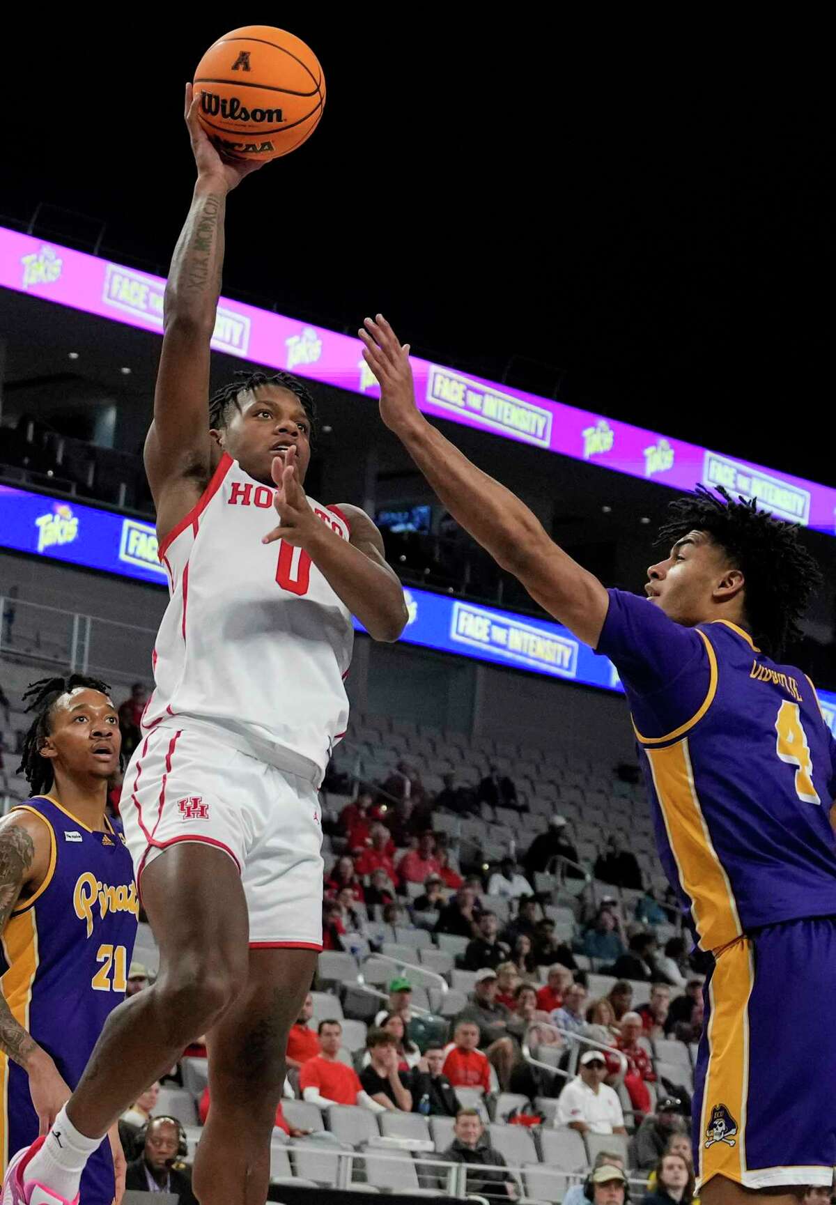 Houston guard Marcus Sasser (0) takes a shot against East Carolina guard Quentin Diboundje (4) during the first half of a quarterfinal basketball game in the American Athletic Conference men's basketball tournament on Friday, March 10, 2023, in Fort Worth.