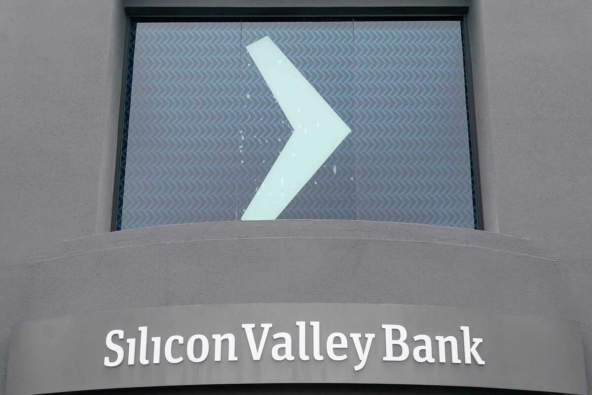 A Silicon Valley Bank sign is shown at the company's headquarters in Santa Clara, Calif., Friday, March 10, 2023. The Federal Deposit Insurance Corporation is seizing the assets of Silicon Valley Bank, marking the largest bank failure since Washington Mutual during the height of the 2008 financial crisis. The FDIC ordered the closure of Silicon Valley Bank and immediately took position of all deposits at the bank Friday.