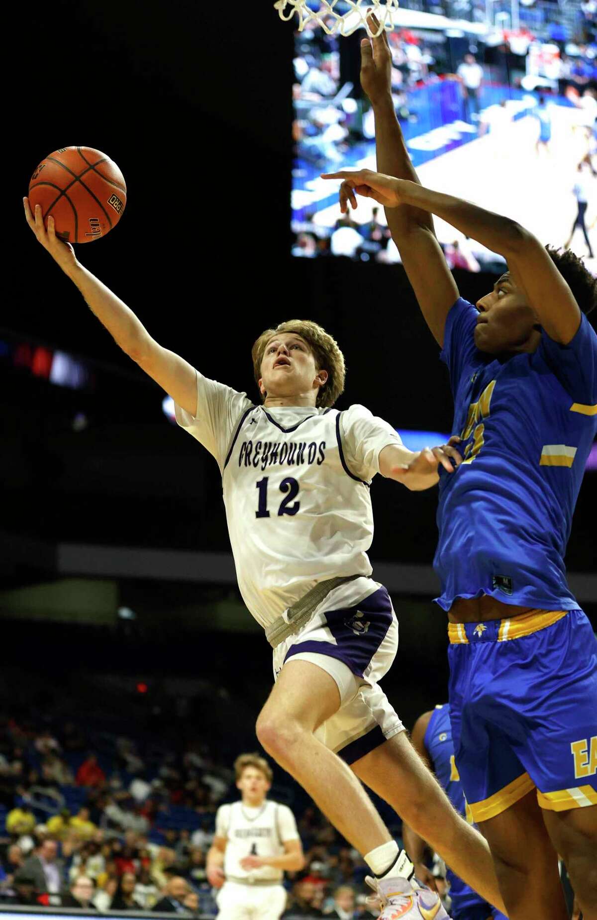 Boerne Barrett Pape (12) drives past a Houston defender. Boerne vs. Houston Washington in a Class 4A state semifinal on Thursday, March 10 ,2023 at the Alamodome.