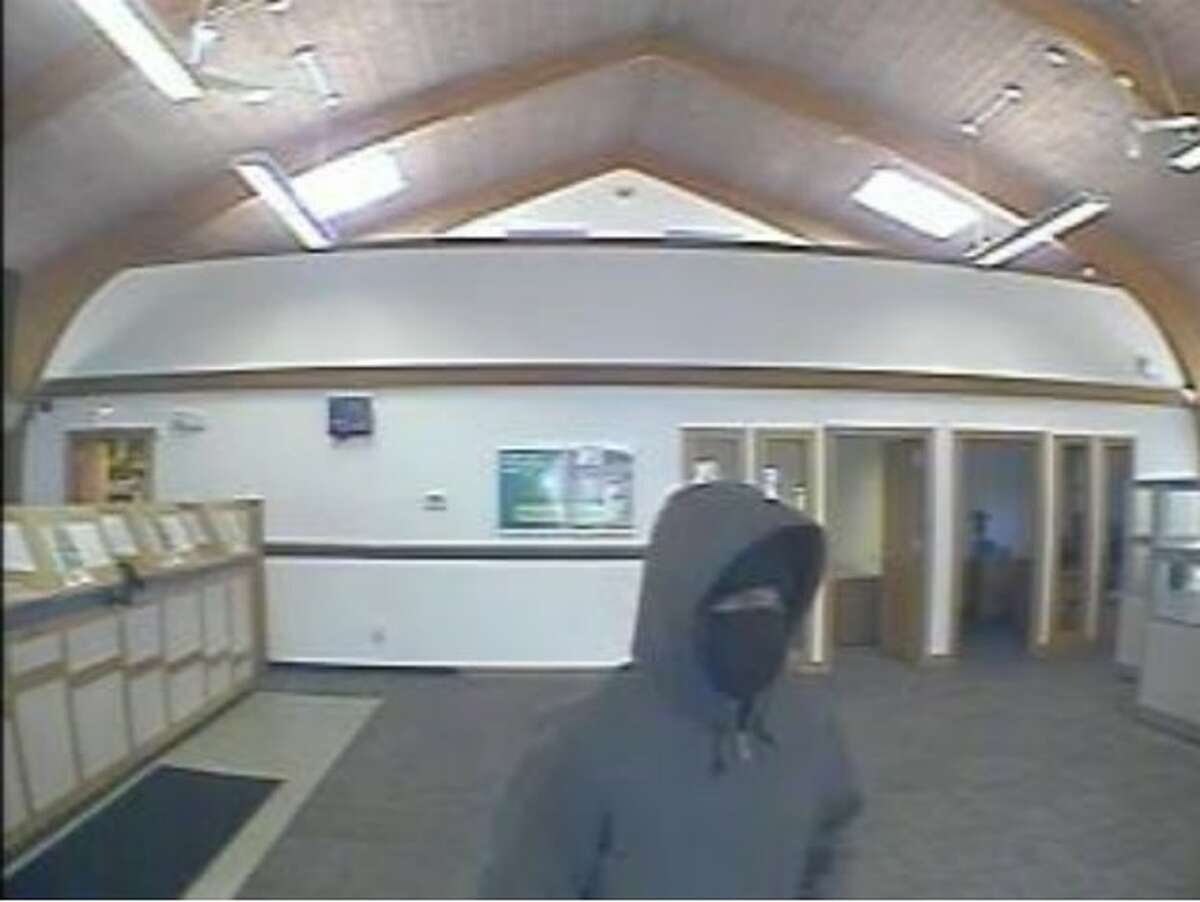An unidentified male suspect handed an Amity Road bank teller a note demanding money in a robbery attempt Friday afternoon, according to Woodbridge police.