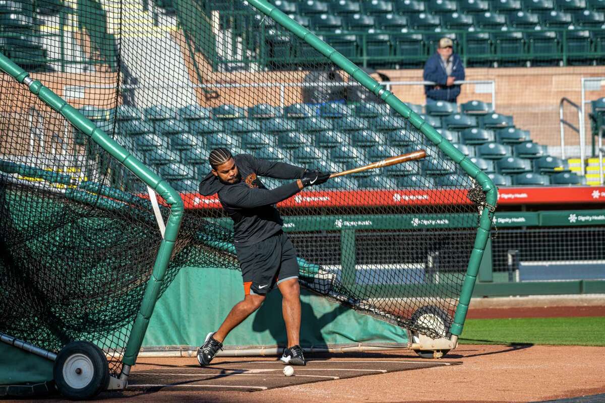 Friday, March 3, 2023 Scottsdale Ariz.—Heliot Ramos (12) practices before the Giants host the Colorado Rockies at the San Francisco Giants spring training facility Scottsdale Stadium in Scottsdale, Ariz. on Friday, March 3, 2023.