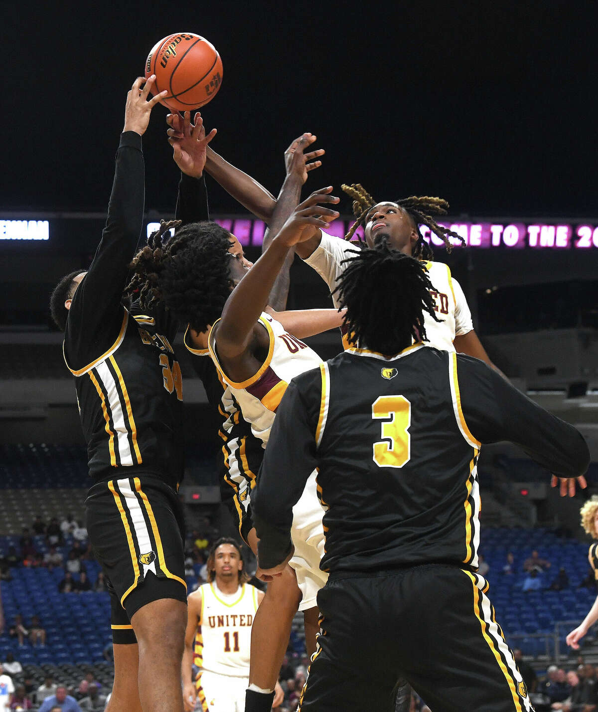 Beaumont United's Daniel Williams battles for the rebound as they take on Brennan in the 6A state semi final at the Alamodome Friday. Photo made Friday, March 10, 2023 Kim Brent/Beaumont Enterprise