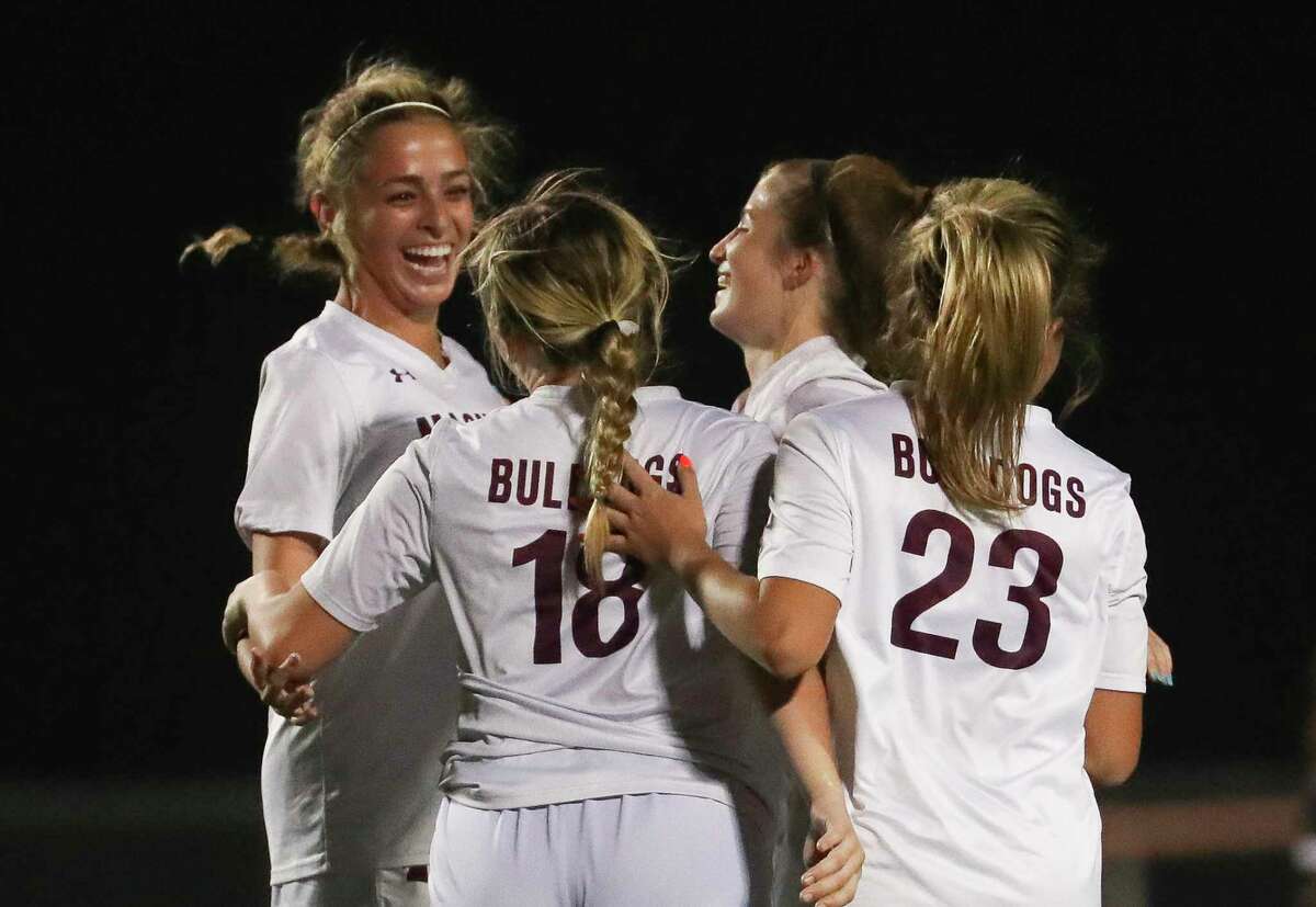 Magnolia players celebrate after Lucca Okeley’s goal gave the Lady Bulldogs a 4-2 lead during the second half of a District 21-5A high school soccer match at Magnolia West High School, Friday, March 10, 2023, in Magnolia.