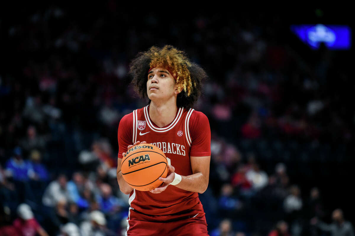 NASHVILLE, TENNESSEE - MARCH 10: Anthony Black #0 of the Arkansas Razorbacks shoots a free throw against the Texas A&M Aggies in the first half during the quarterfinals of the 2023 SEC Men's Basketball Tournament at Bridgestone Arena on March 10, 2023 in Nashville, Tennessee. (Photo by Carly Mackler/Getty Images)