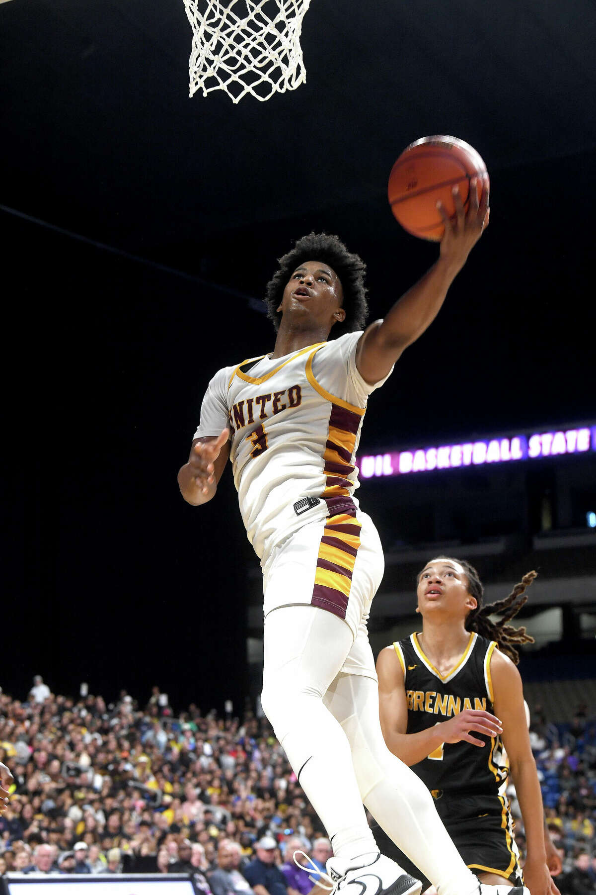 Wesley Yates makes a drive up to the basket as Beaumont United takes on Brennan in the 6A state semi final at the Alamodome Friday. Photo made Friday, March 10, 2023 Kim Brent/Beaumont Enterprise