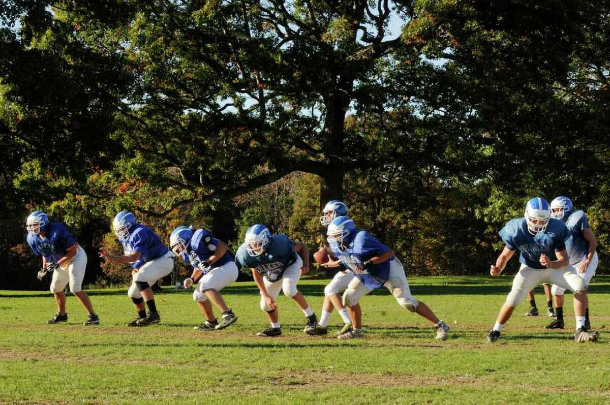 High school football -- The Shaker offense runs through drills during practice. (Michael P. Farrell / Times Union)