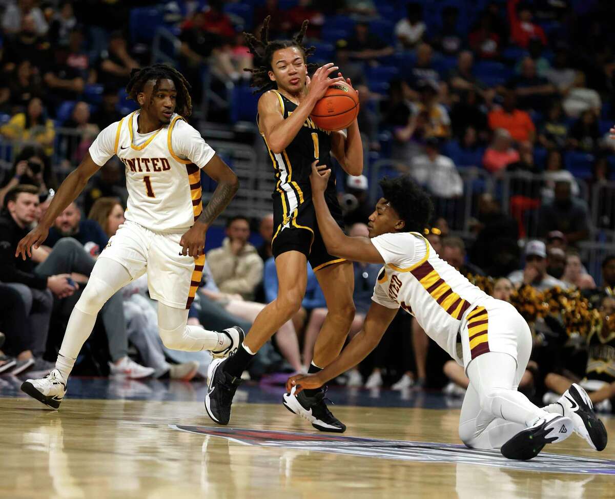 Brennan Kingston Flemings (1) tries to avoid the steal from Beaumont United Wesley Yates III (3) in a Class 6A state semifinal on Friday, March 10, 2023 at the Alamodome.