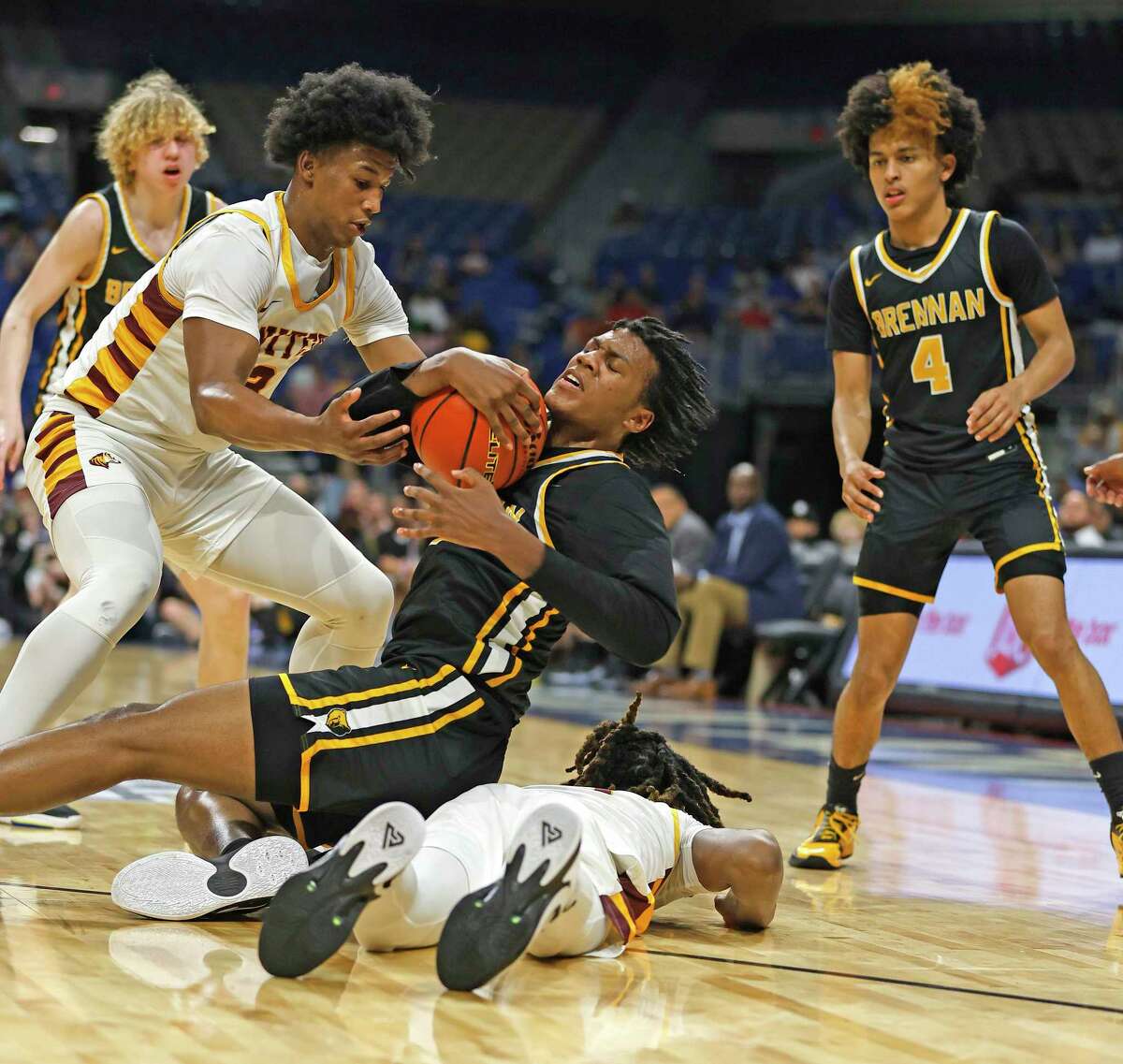 Brennan Robert Jackson (3) is trapped by Beaumont United Wesley Yates III (3) in a Class 6A state semifinal on Friday, March 10, 2023 at the Alamodome.