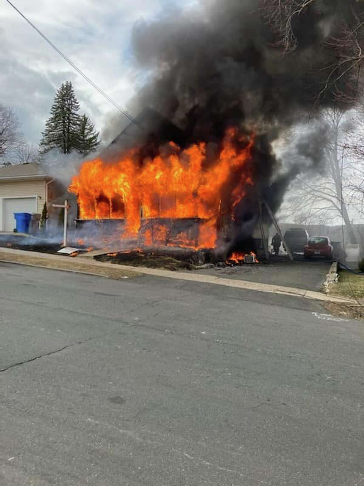 A huge blaze destroyed a two-family home on South Street Extension and displaced four people Friday afternoon, the Bristol Fire Department said.