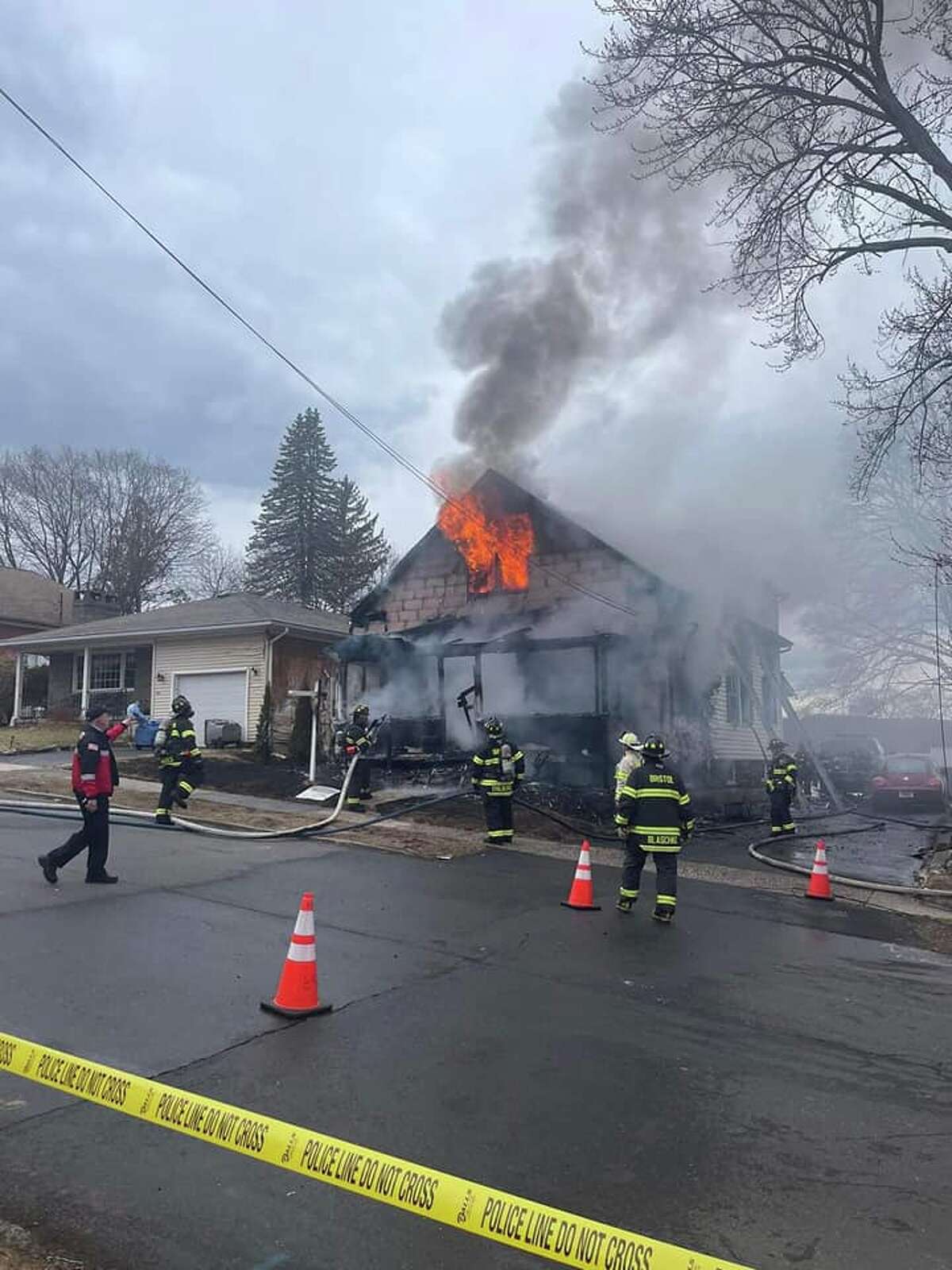 A huge blaze destroyed a two-family home on South Street Extension and displaced four people Friday afternoon, the Bristol Fire Department said.