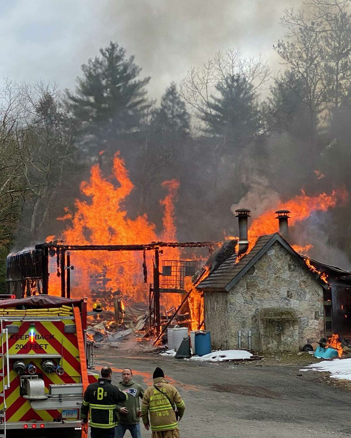 An outbuilding that shares land with a modern-day castle at 450 Brickyard Road caught fire Saturday afternoon, the Woodstock Volunteer Fire Association said.