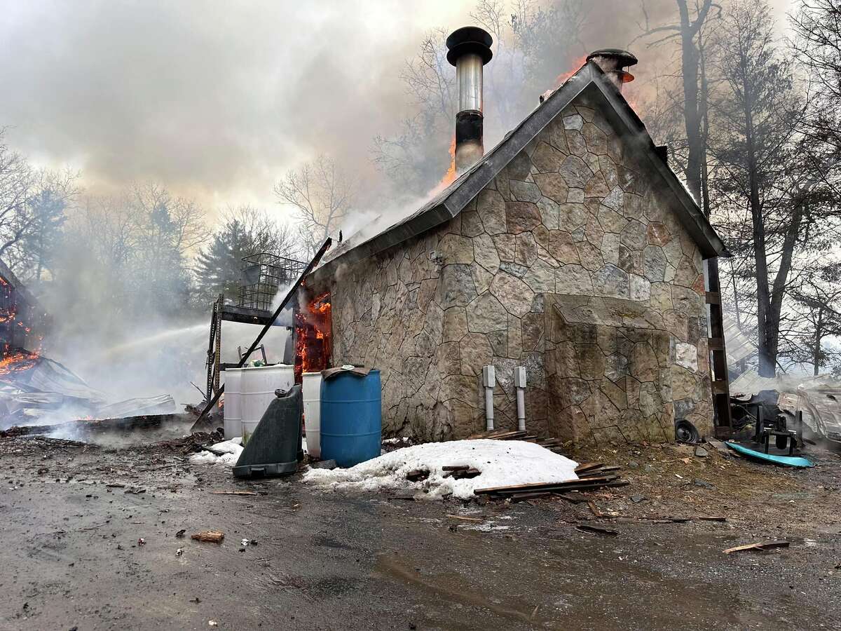 An outbuilding that shares land with a modern-day castle at 450 Brickyard Road caught fire Saturday afternoon, the Woodstock Volunteer Fire Association said.