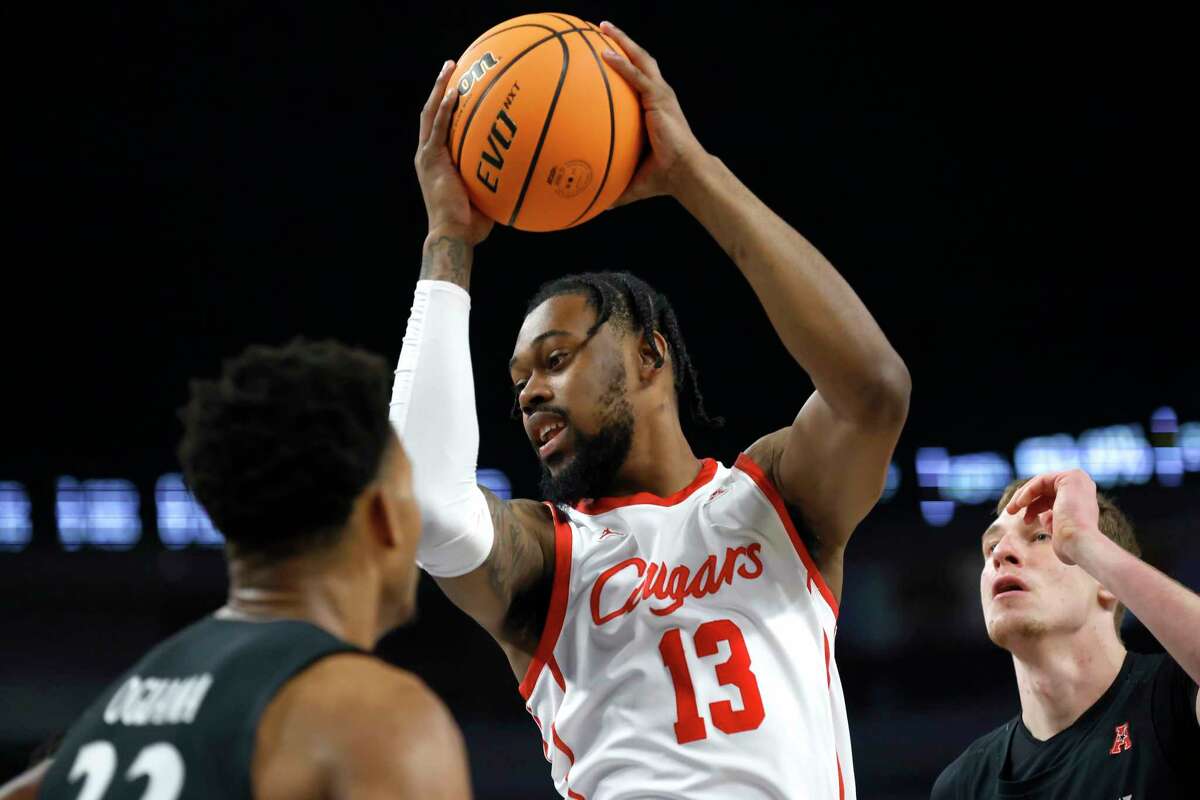 Houston forward J'Wan Roberts (13) rebounds against Cincinnati during the second half of an NCAA college basketball game in the semifinals of the American Athletic Conference Tournament, Saturday, March 11, 2023, in Fort Worth, Texas.