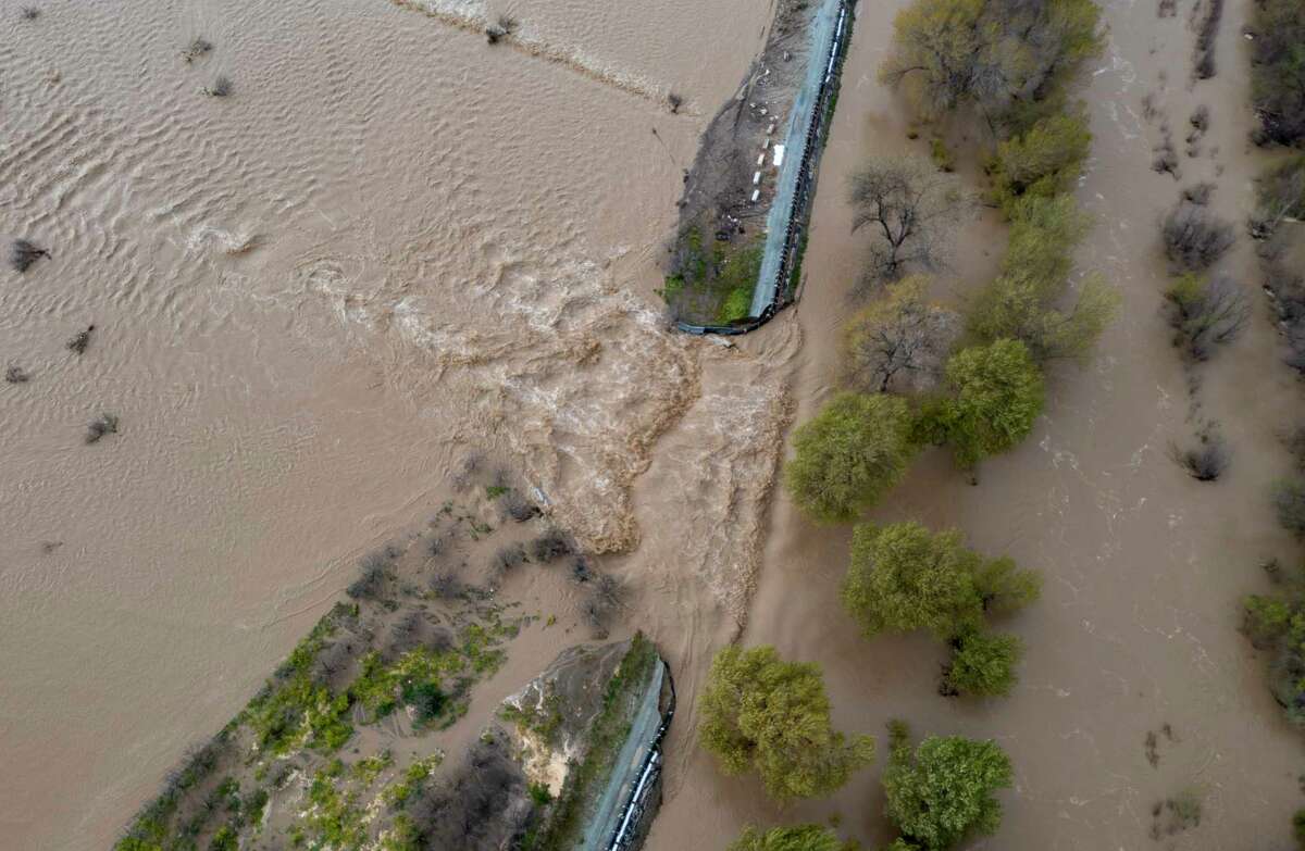 See drone video of Pajaro flowing through levee, devastating flooding