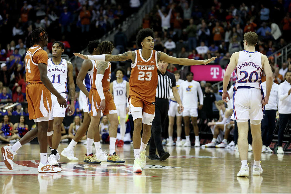 KANSAS CITY, MISSOURI - MARCH 11: Dillon Mitchell #23 of the Texas Longhorns celebrates a basket against the Kansas Jayhawks during the second half of the Big 12 Tournament Championship game at T-Mobile Center on March 11, 2023 in Kansas City, Missouri. (Photo by Jamie Squire/Getty Images)