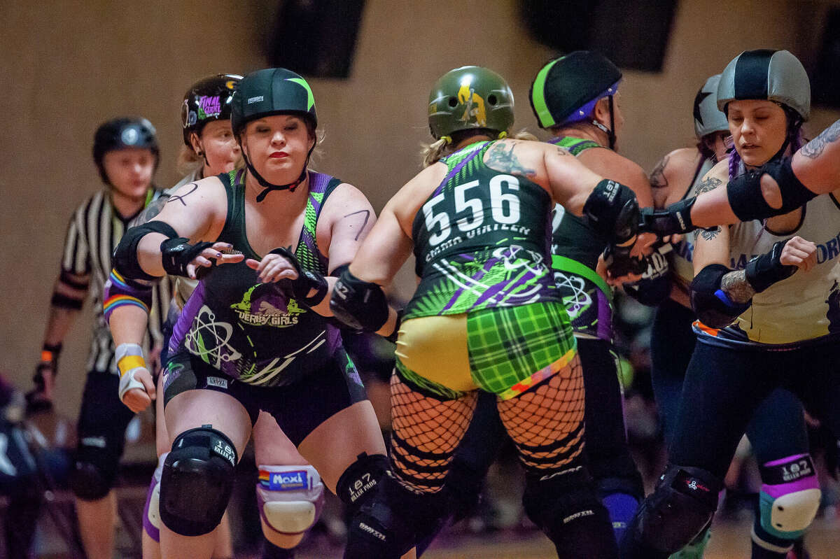 Chemical City Derby Girl skater Fitch Slap competes in a bout against the Lakeshore Roller Derby on March 11, 2023 at the Midland Roll Arena.
