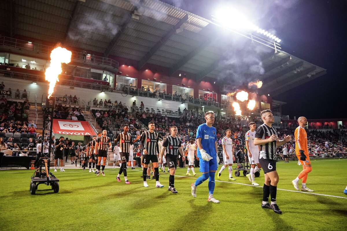 Amid pyrotechnics, SAFC players are introduced during their home opener Saturday night at Toyota Field versus the Oakland Roots.
