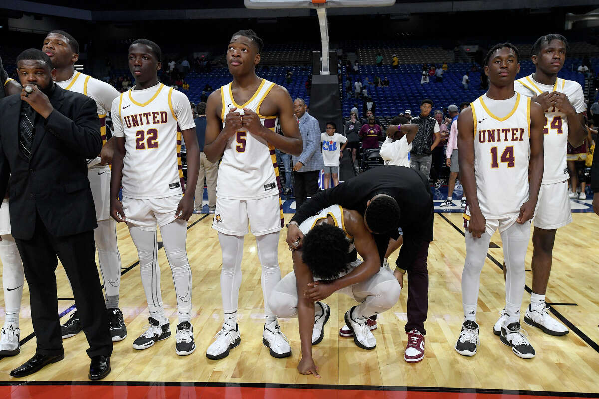 A coach comforts Wesley Yates after Beaumont United fell to Lake Highlands for the 6A state title at the Alamodome Saturday. Photo made Saturday, March 11, 2023 Kim Brent/Beaumont Enterprise