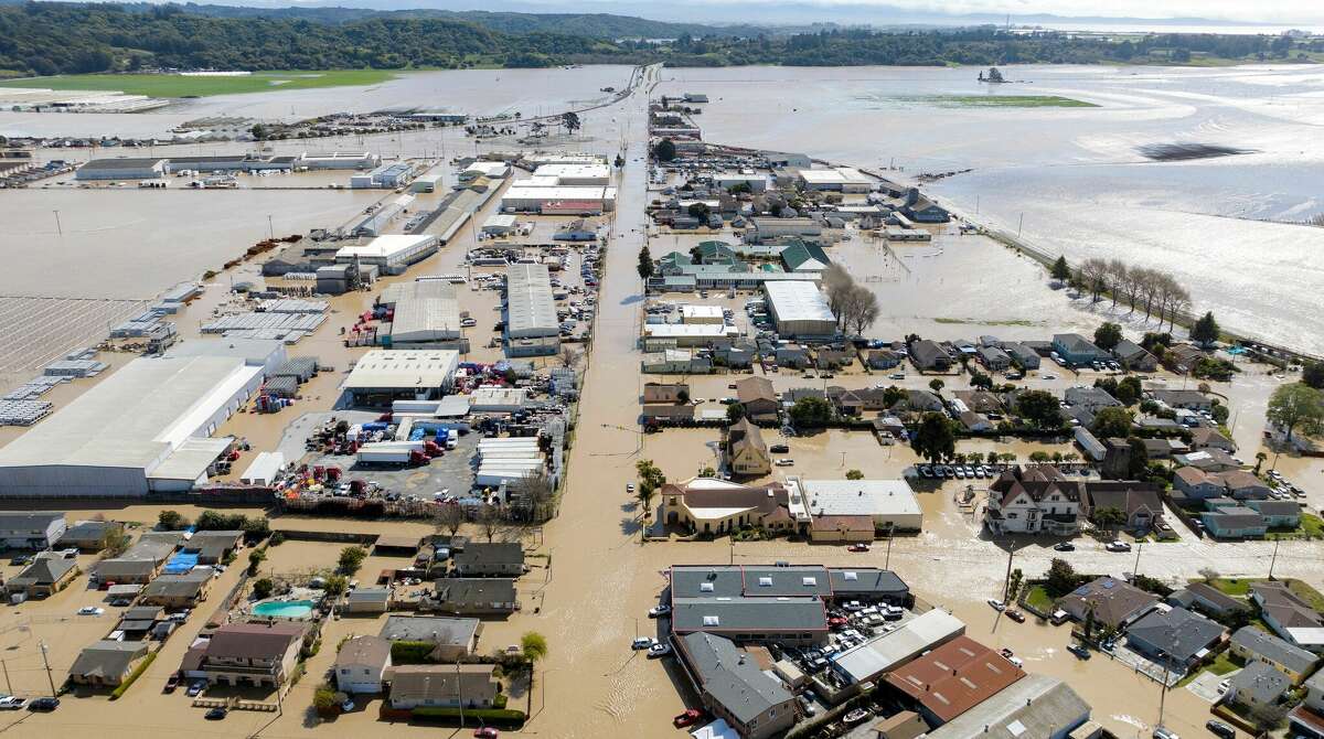 Residents in Pajaro, Calif., were forced to evacuate in the middle of the night after an atmospheric river surge broke a Pajaro River levee and sent floodwaters flowing into the community on Saturday.