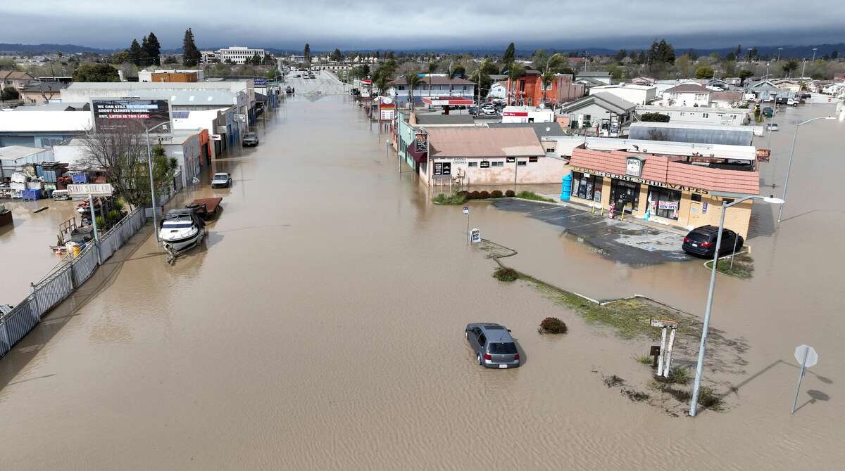 An aerial view shows a flooded neighborhood in the unincorporated community of Pajaro in Watsonville, Calif., on Saturday.