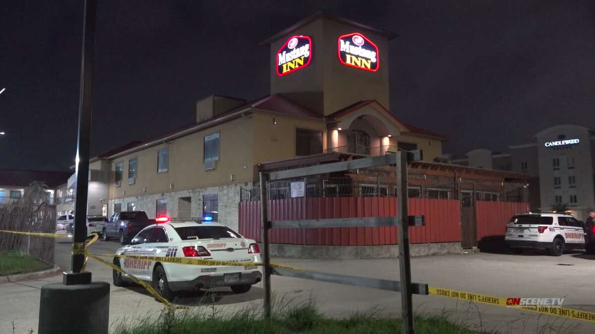 Harris County Sheriff's Office officials investigate a reported shooting at a Mustang Inn on North Freeway.