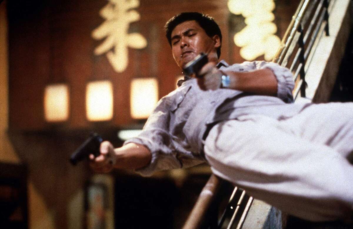 Chow Yun-Fat slides down a banister with guns blazing in John Woo's classic action film 'Hard-Boiled' and still doesn't work up a sweat.