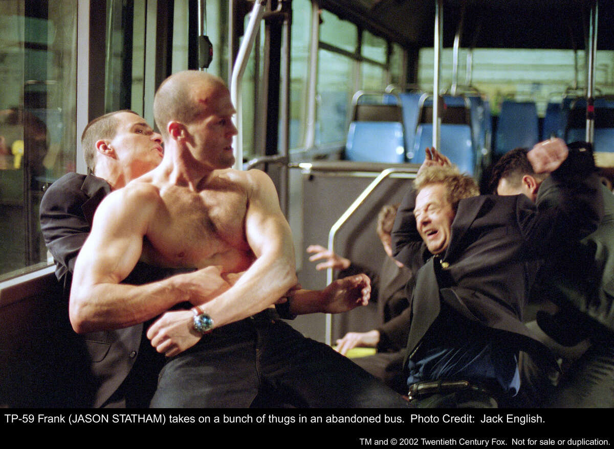 What do you mean I need a shirt to ride the bus? Riders get their tickets punched by Frank (Jason Statham) in 'The Transporter.' 