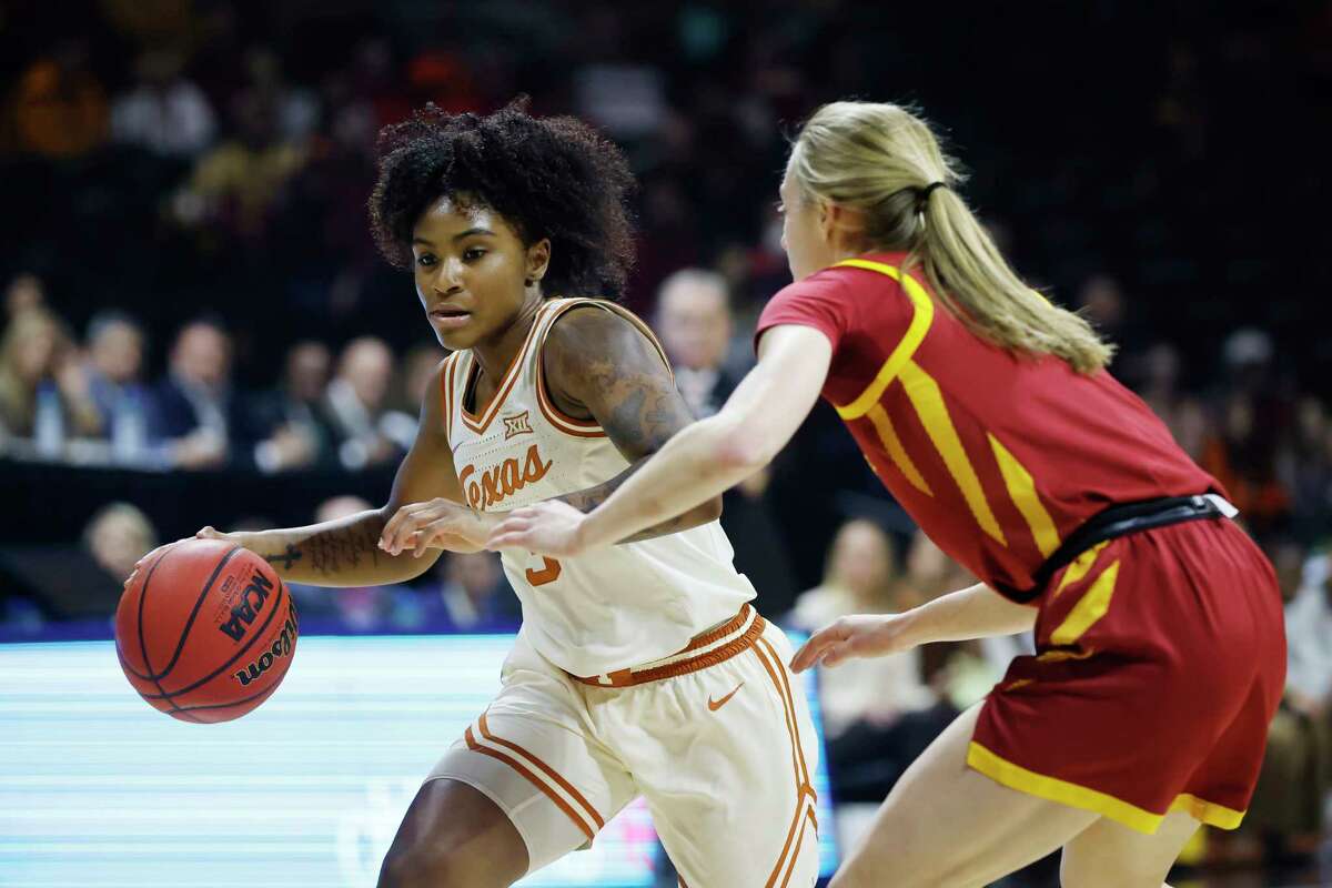 Texas guard Rori Harmon (3) attempts to get past Iowa State guard Denae Fritz (3) during the first half of the NCAA college basketball championship game of the Big 12 Conference tournament, Sunday, March 12, 2023, in Kansas City, Mo.