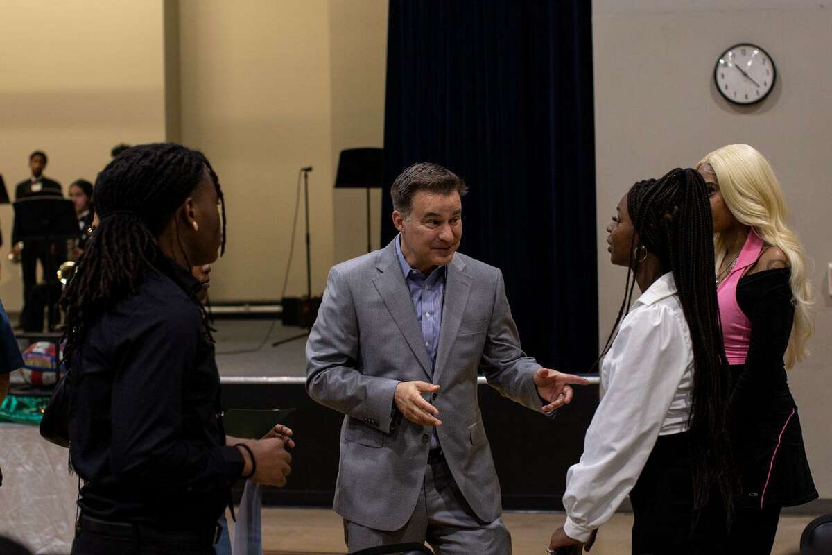 State Sen. Roland Gutierrez speaks with a handful of the scholarship winners at the Friends of Sam Houston High School annual community scholarship breakfast at the Second Baptist Church Community Center on Saturday morning. (Kaylee Greenlee Beal/Contributor)