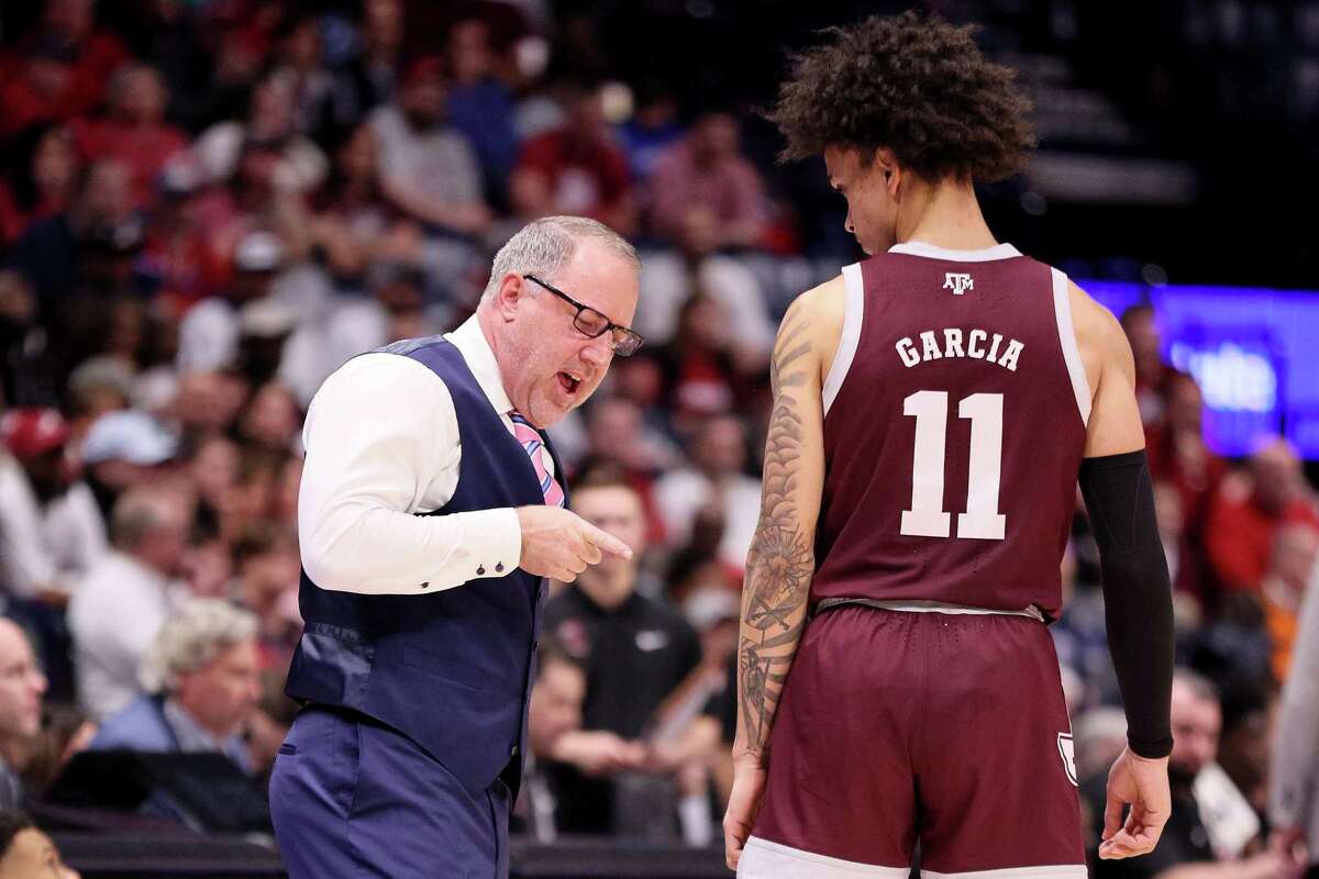 Texas A&M head coach Buzz Williams talks with Andersson Garcia during a break against Alabama during the second half of the SEC tournament final on Sunday in Nashville, Tenn.