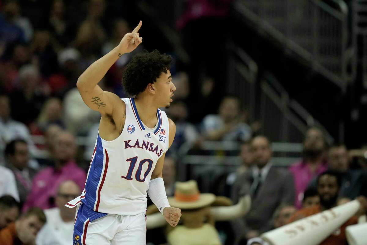 Kansas forward Jalen Wilson celebrates after making a basket during the first half of the NCAA college basketball championship game against Texas in the Big 12 Conference tournament Saturday, March 11, 2023, in Kansas City, Mo.