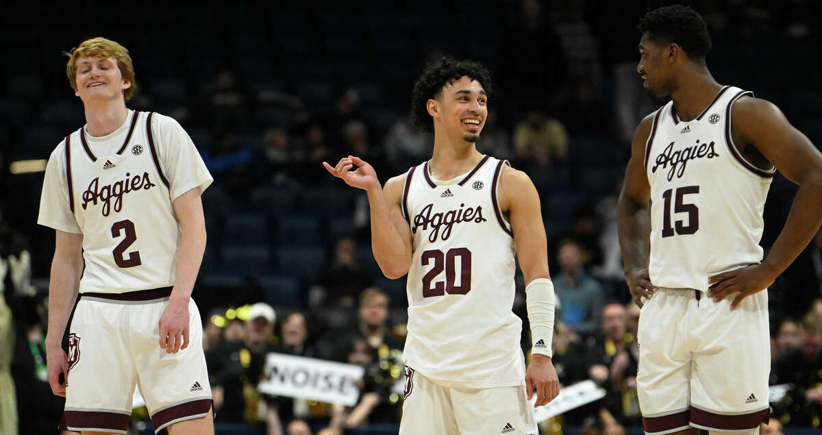 Texas A&M's Hayden Hefner (2), Andre Gordon (20) and Henry Coleman III (15) joke with each other in the final moments of an NCAA college basketball game against Vanderbilt in the semifinals of the Southeastern Conference Tournament, Saturday, March 11, 2023, in Nashville, Tenn. (AP Photo/John Amis)