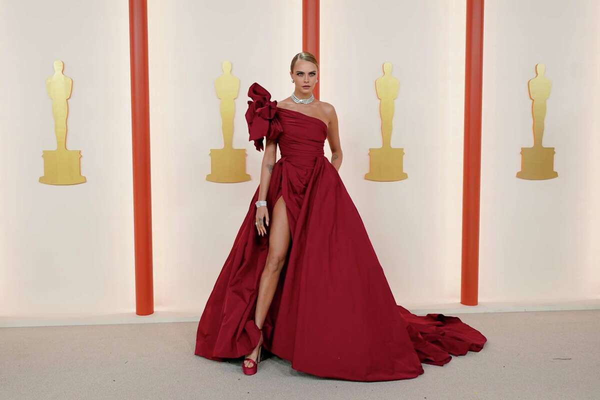 Cara Delevingne arrives at the Oscars on Sunday, March 12, 2023, at the Dolby Theatre in Los Angeles.