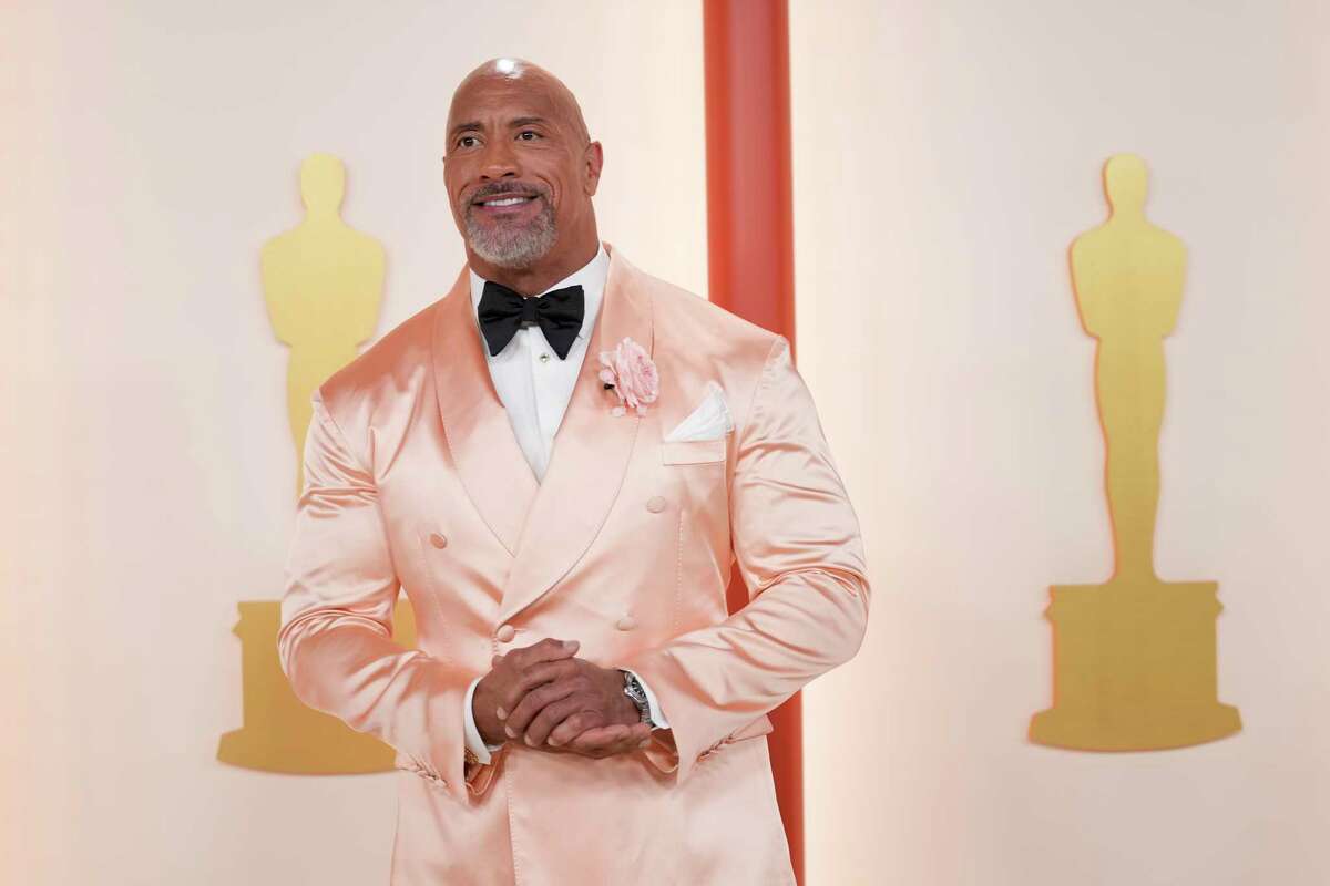 Dwayne Johnson arrives at the Oscars on Sunday, March 12, 2023, at the Dolby Theatre in Los Angeles.