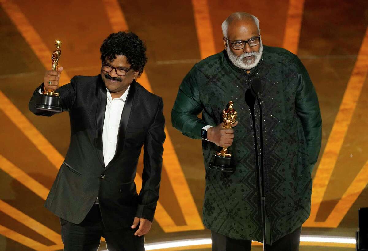 M.M. Keeravaani, right, and Chandrabose accept the award for best original song for "Naatu Naatu" from "RRR" at the Oscars on Sunday, March 12, 2023, at the Dolby Theatre in Los Angeles.