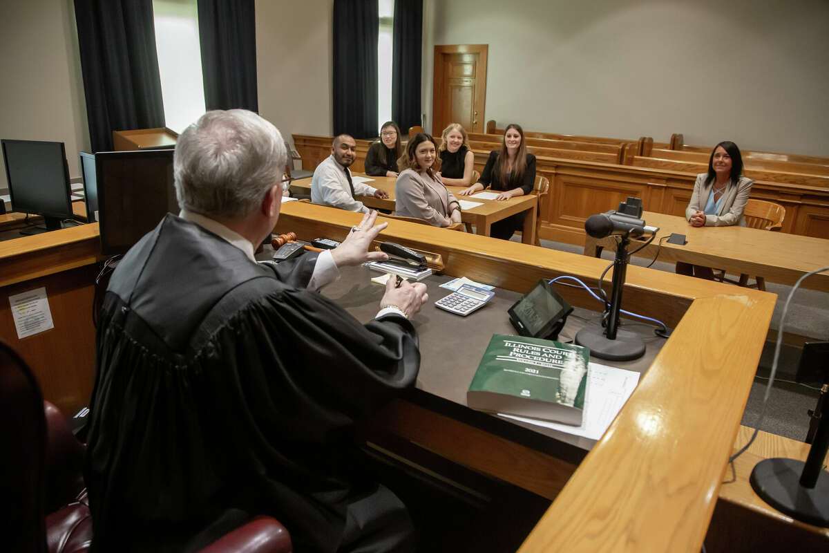 Circuit Judge Dennis Ruth meets with a group of L&C paralegal students in his Madison County courtroom.