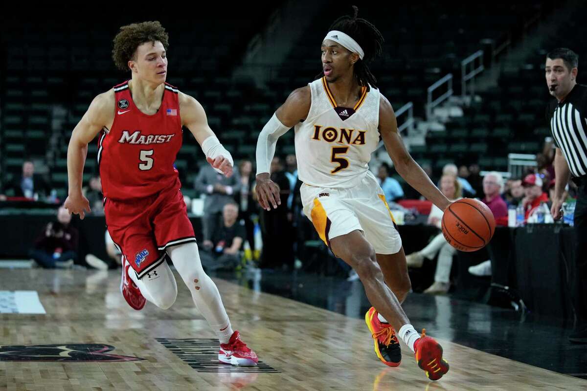 Iona's Daniss Jenkins, right, dribbles past Marist's Isaiah Brickner in the MAAC title game on Saturday, March 11, 2023, in Atlantic City N.J.